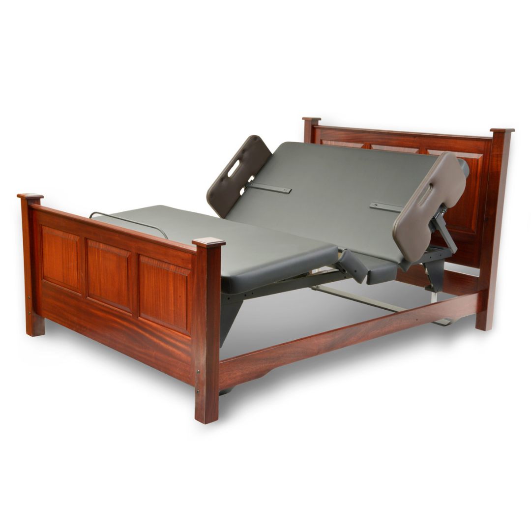 The Assured Comfort® Signature Series Hi-Low Adjustable Bed features a wooden frame with paneled headboard and footboard, gray mattress, and customizable raised head and leg sections for superior support and comfort.
